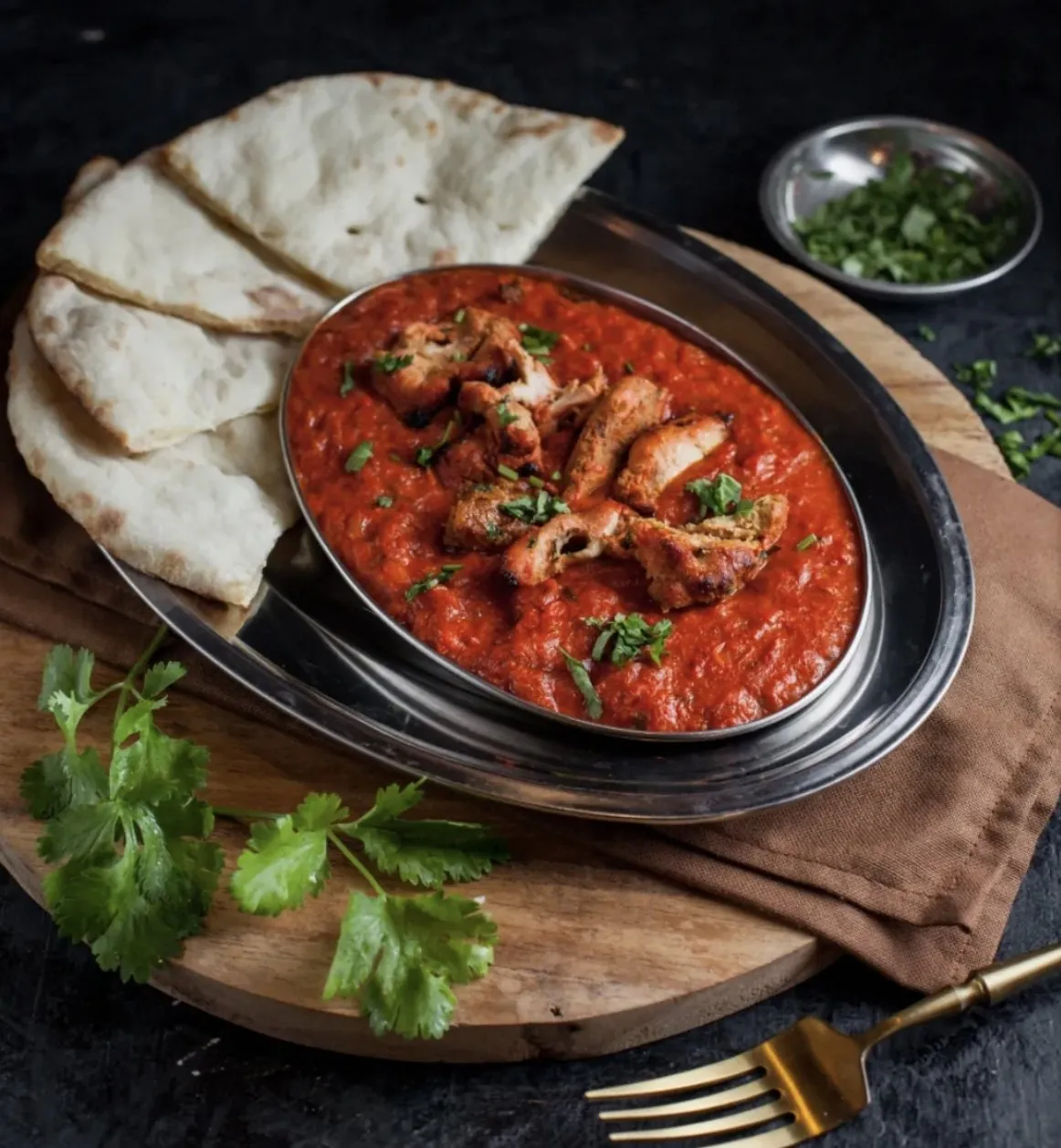 Creamy chicken tikka masala curry served at Nana Sans Indian restaurant Canggu