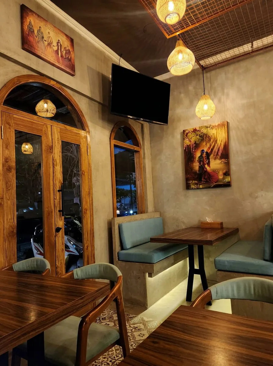 Air-conditioned indoor dining room at Nana Sans Indian restaurant in Canggu